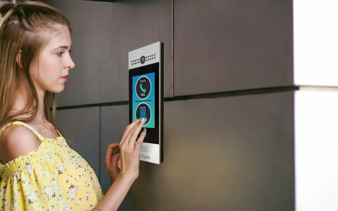 Individual using Watchman W461 color touch screen access control system