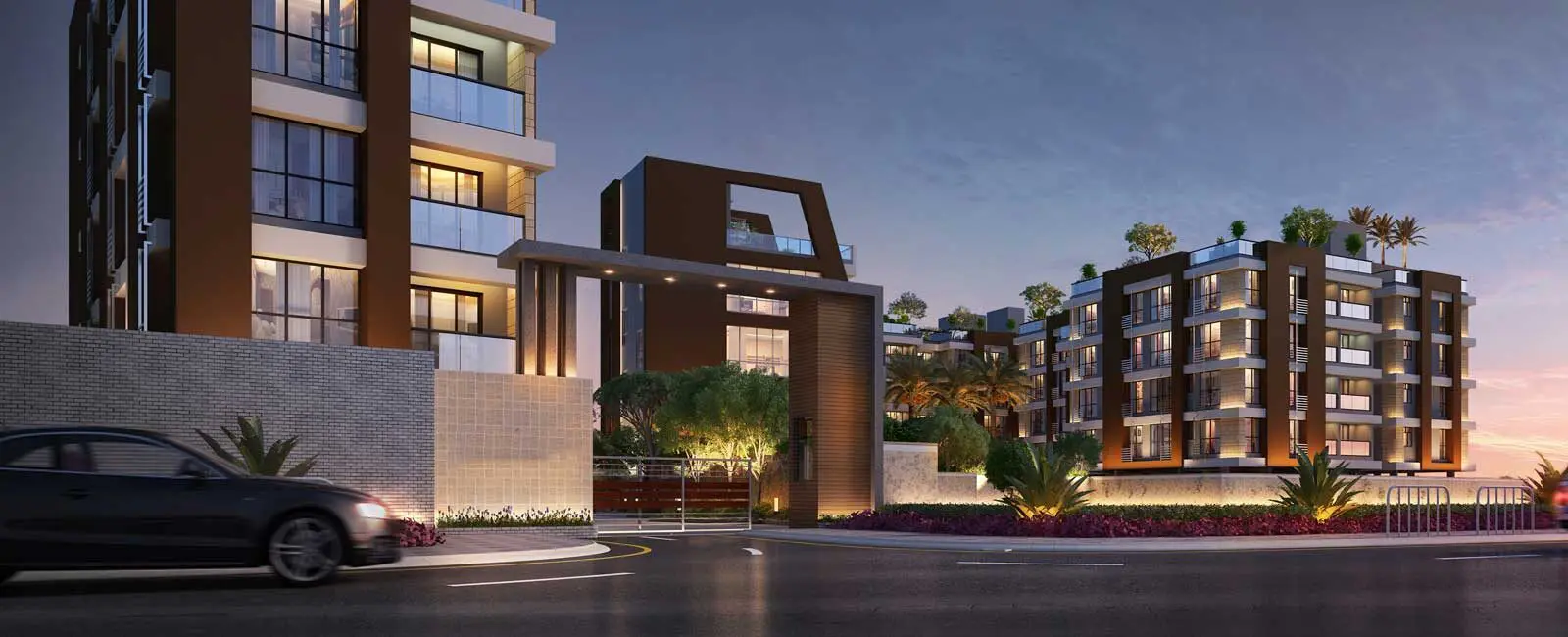 Gated entrance to a multi-family residential community with houses in background