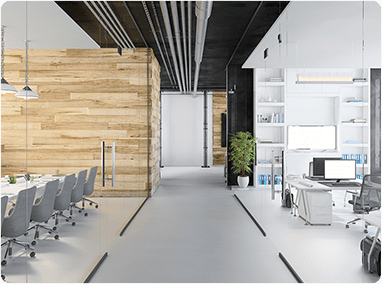 Modern open-plan office with wood accent wall, conference seating, and bright workstations