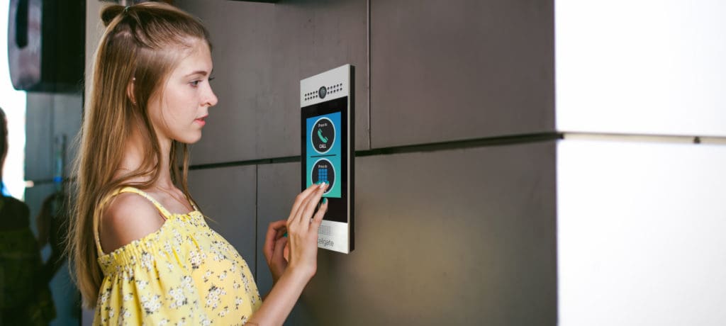 Individual using Watchman W461 color touch screen access control system