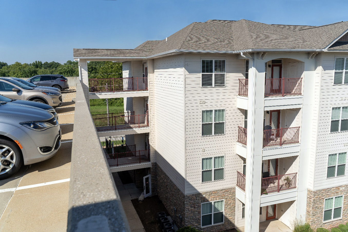 View of four connecting “bridges” from the Vanguard Crossing Apartments’ resident parking garage to one group of apartments - CellGate access control system solution white paper