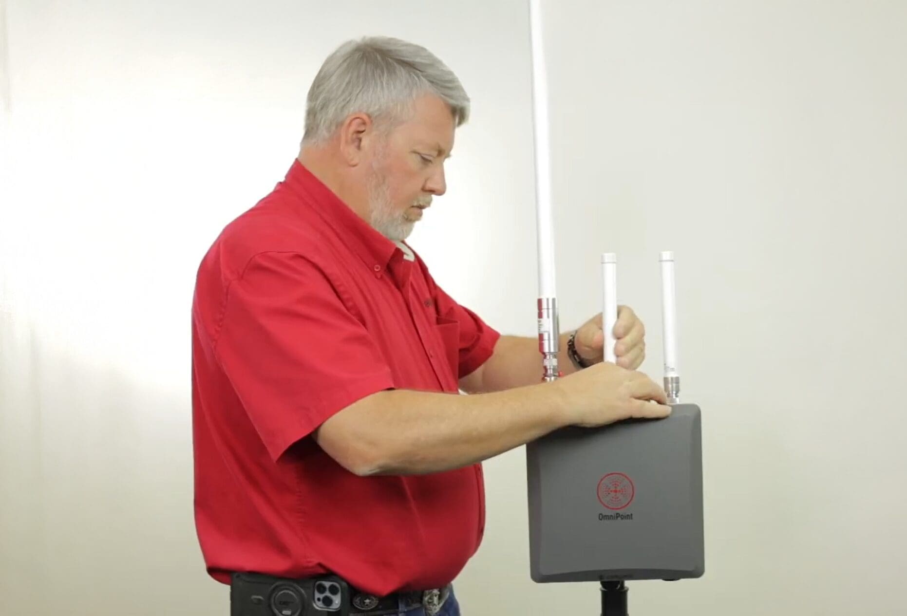 Field technician installing access control system at customer site